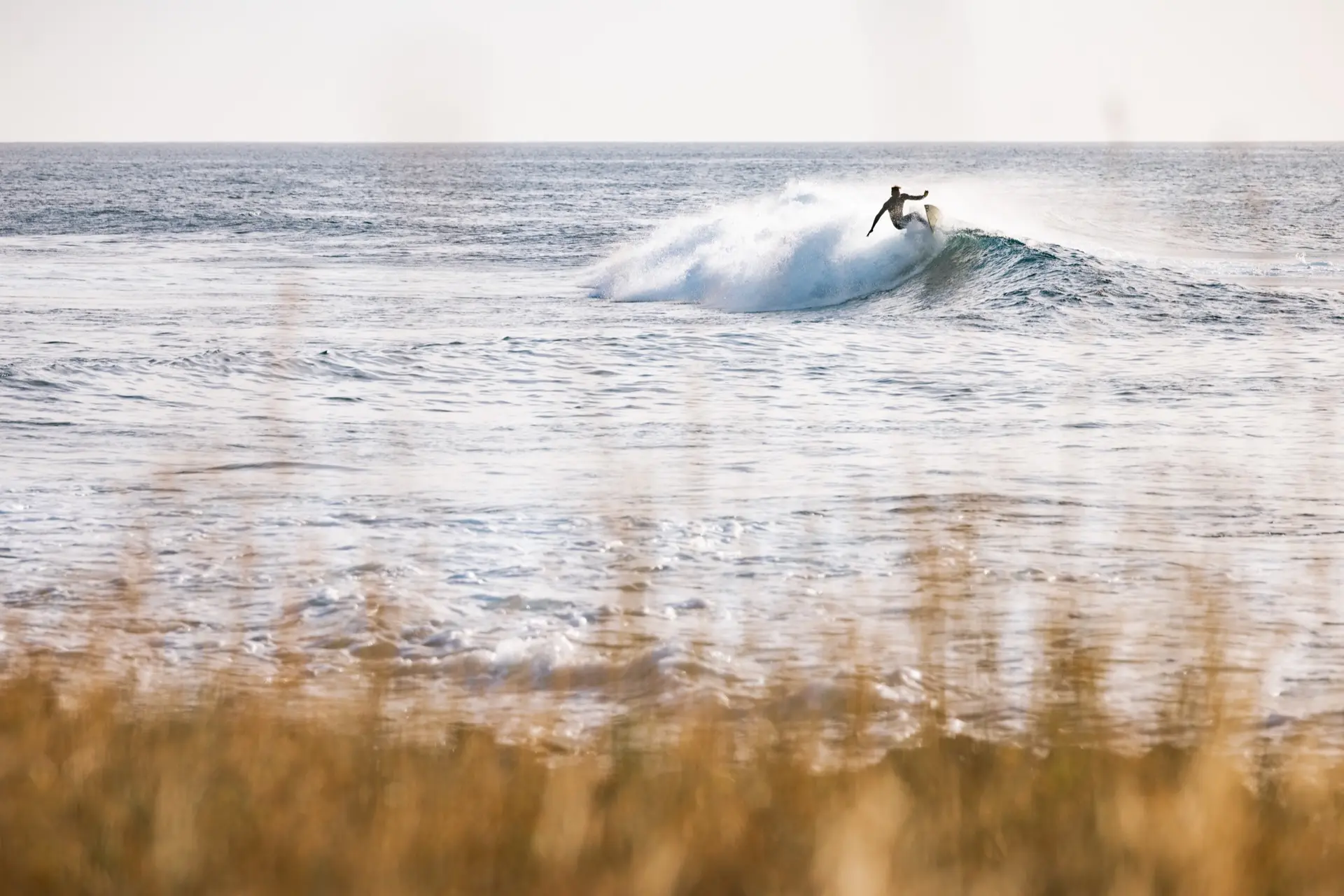 Surfer riding a wave in Tarrafal
