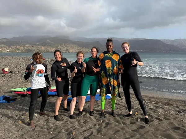 Happy surf students with Kabungo after lesson