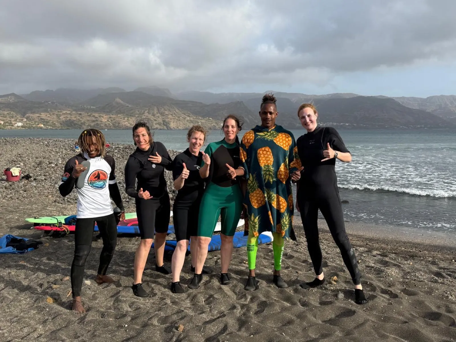 Happy surf students with Kabungo after lesson