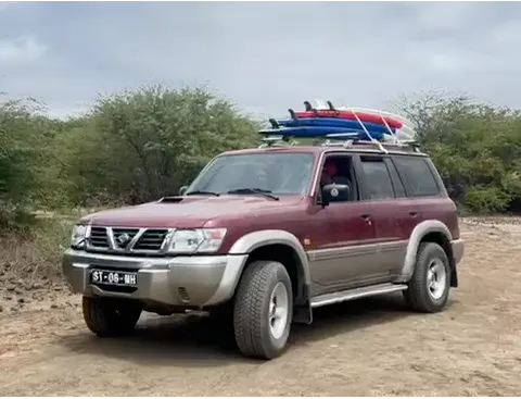 Jeep with surfboards — transport included